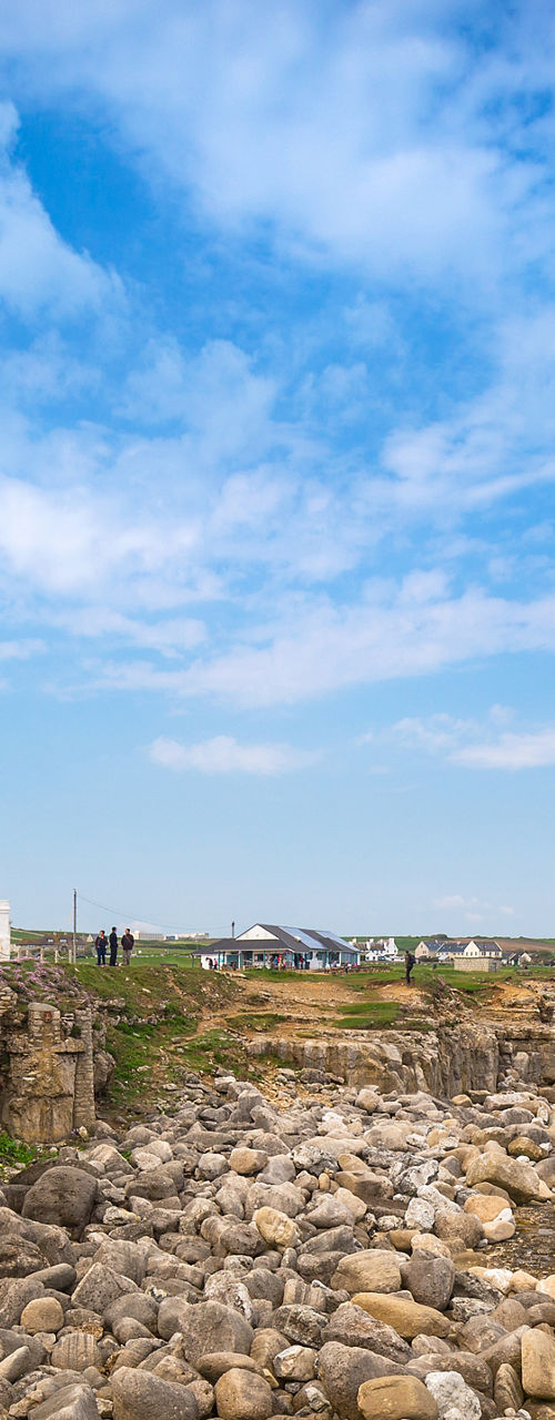 Coastal lighthouse with rocky shoreline view