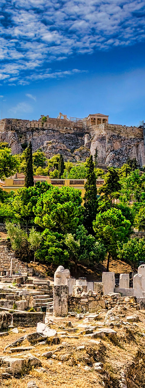 Ancient ruins under vibrant blue sky