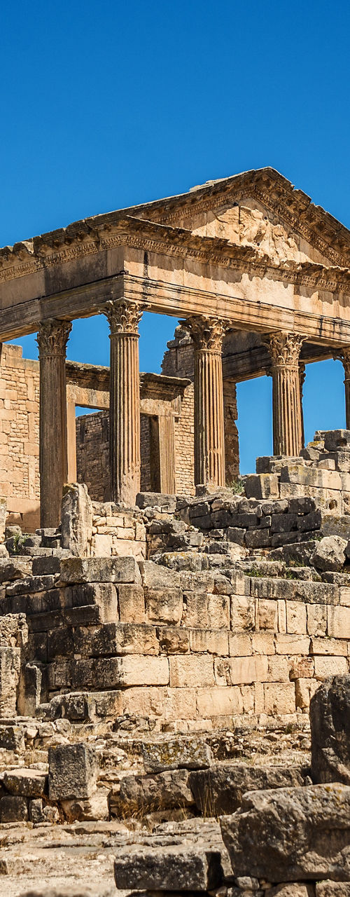 Ancient stone temple ruins under blue sky