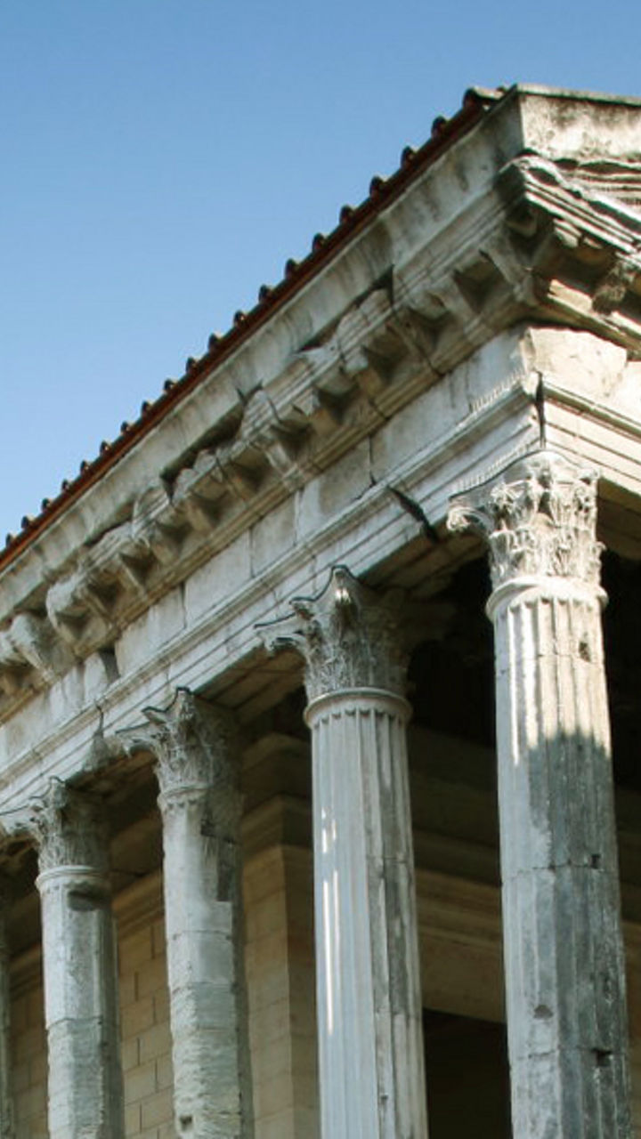 Ancient Roman temple in urban setting
