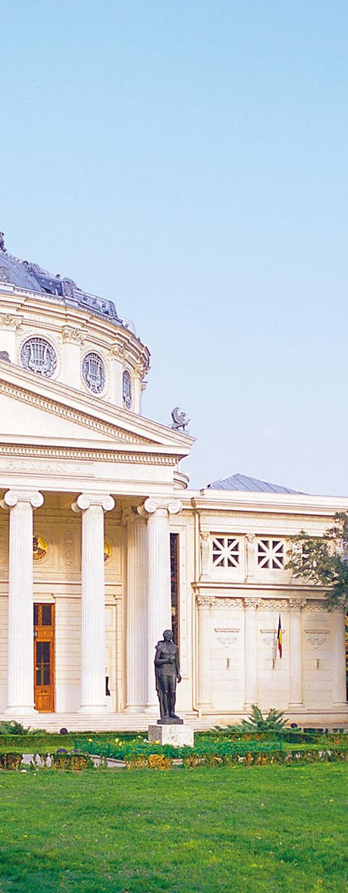 Historic building with lush green garden