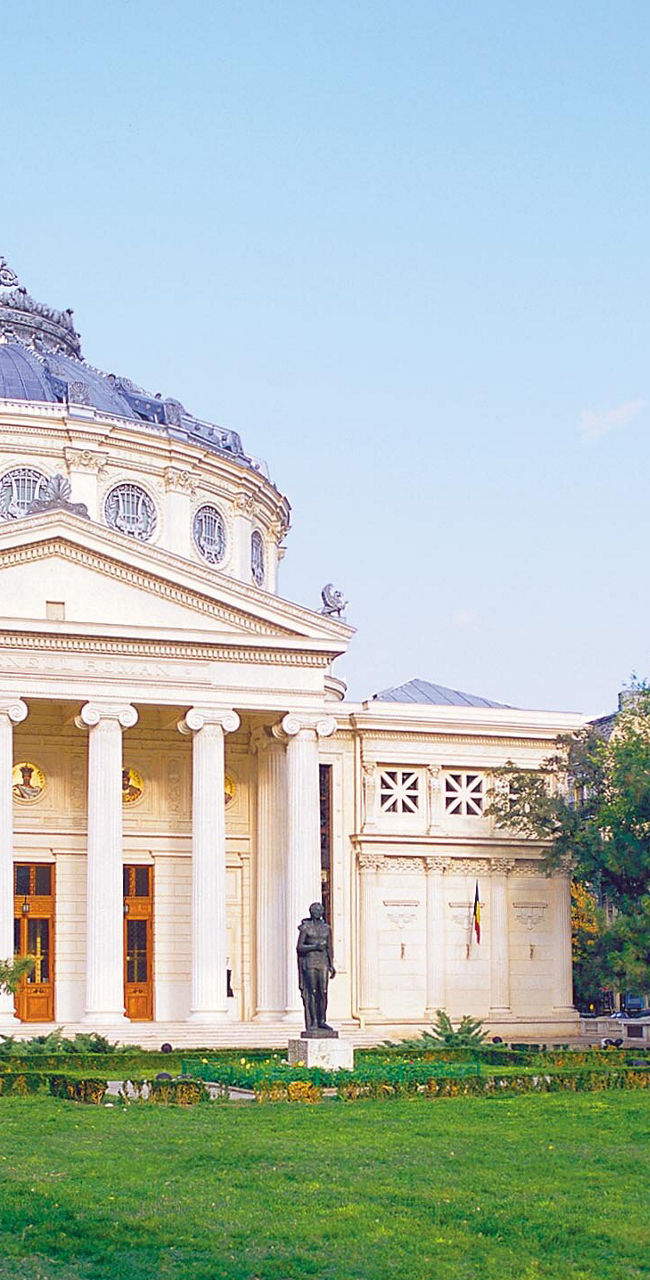 Historic building with lush green garden