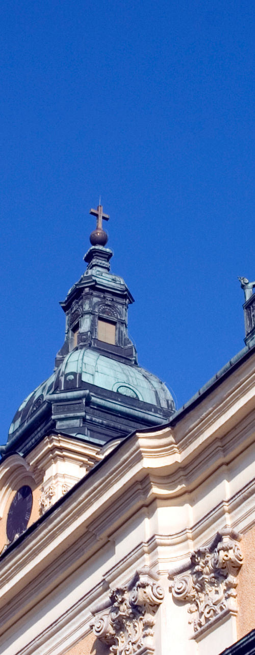Historic church with twin towers under blue sky