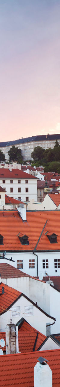 Scenic view of Prague rooftops at sunset