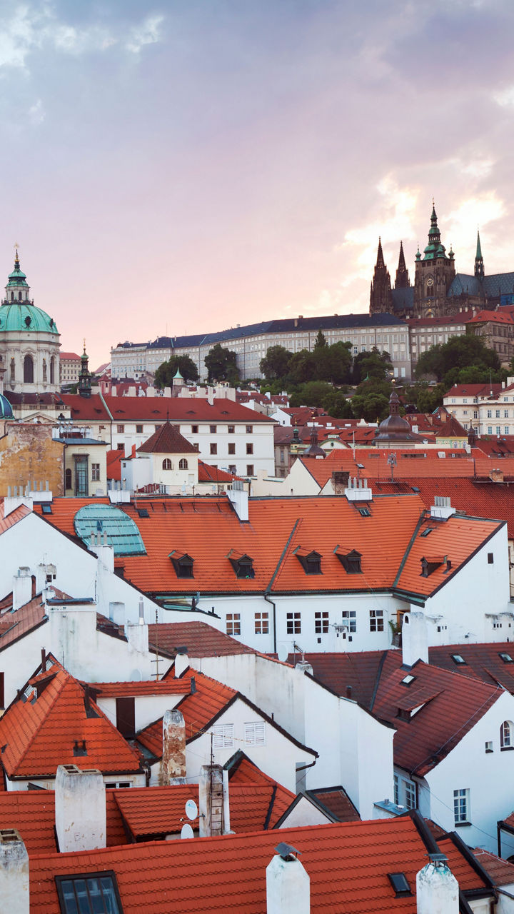 Scenic view of Prague rooftops at sunset