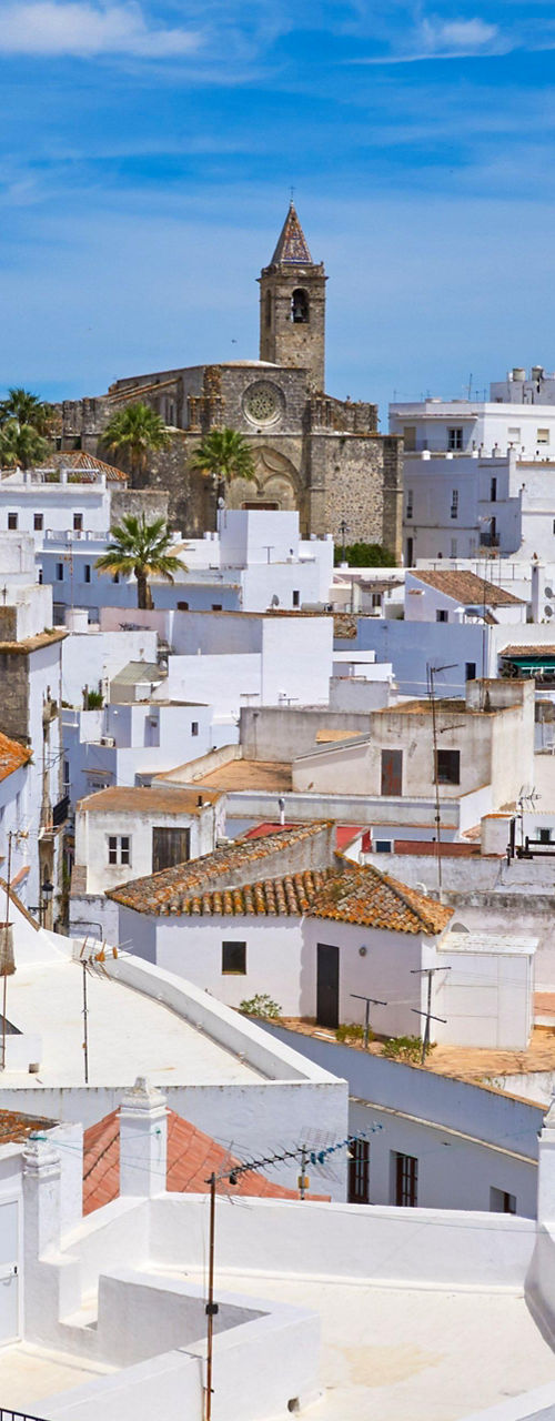 Whitewashed village under clear blue sky