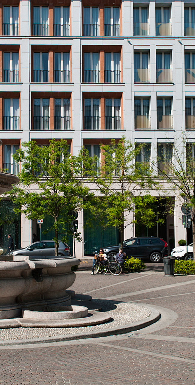 Starhotels building with fountain in plaza