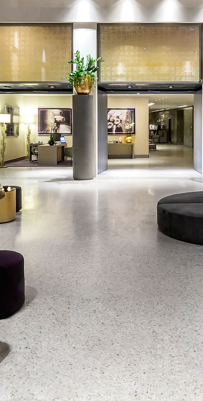 Modern lobby with glass ceiling and seating