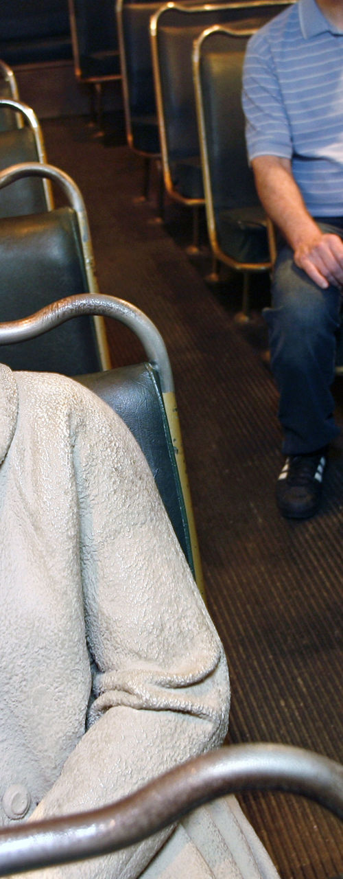 Historic bus interior with seated figures