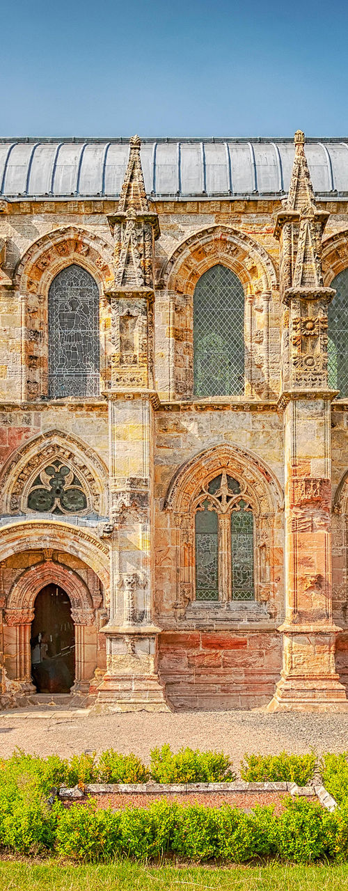 Historic Rosslyn Chapel under clear blue sky