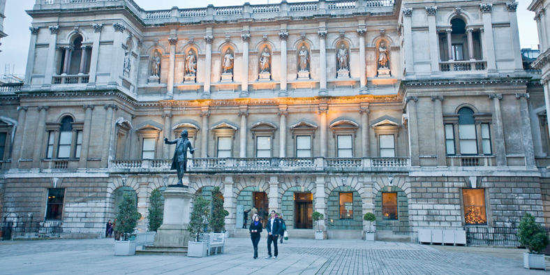 Historic building with statue in courtyard
