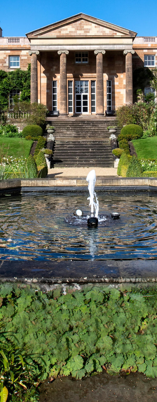 Elegant estate with fountain and gardens