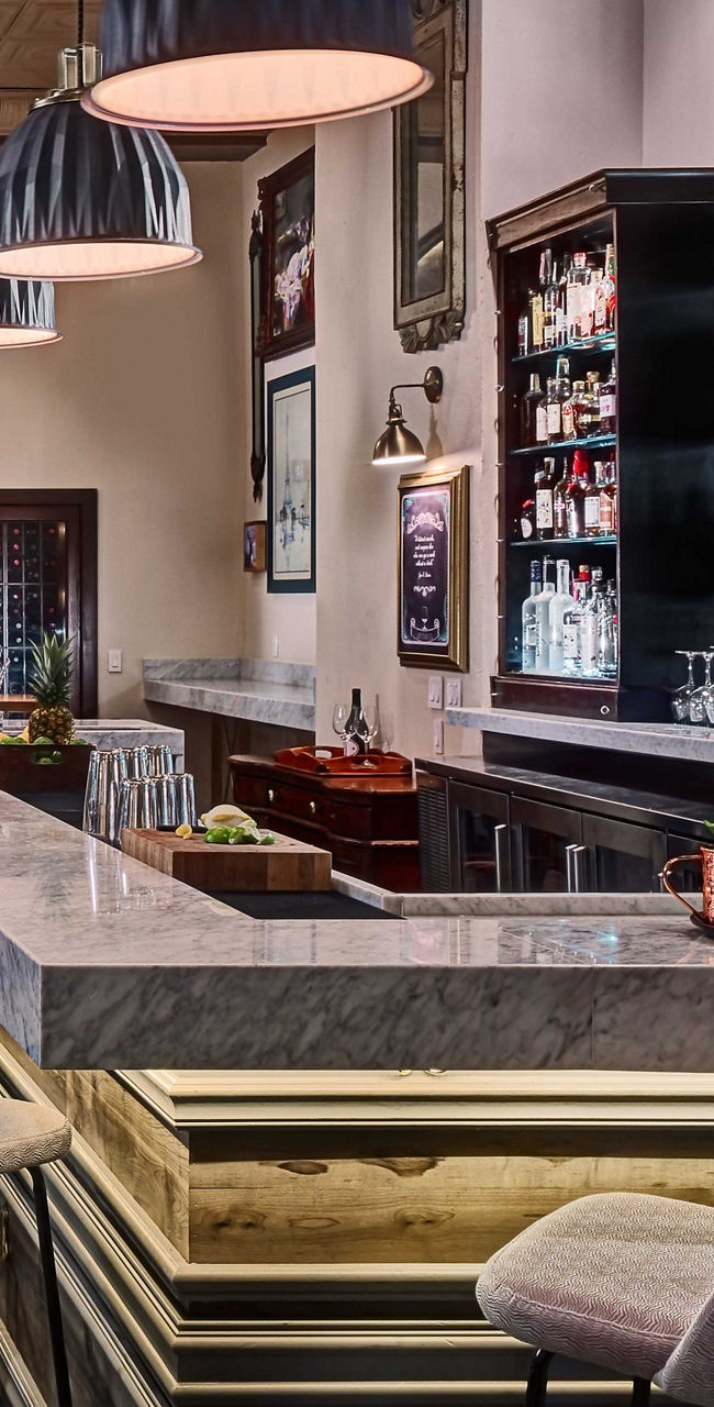 Modern hotel bar with illuminated liquor shelves