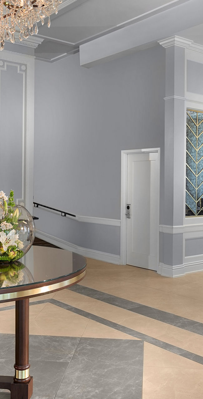 Elegant hotel lobby with chandeliers and reception