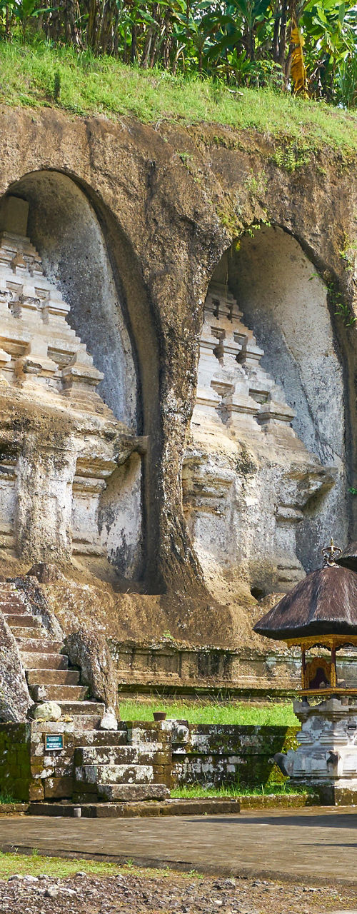 Ancient rock temple with tropical surroundings