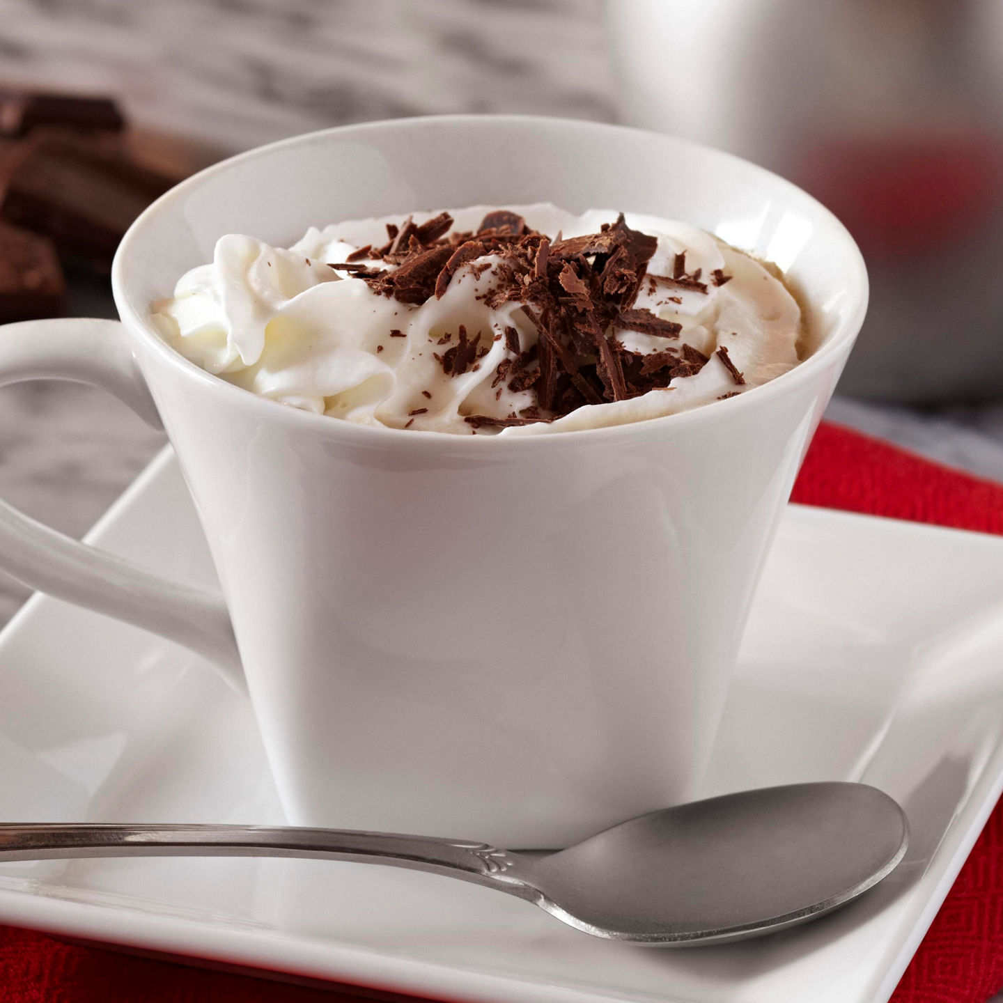 Hot chocolate with whipped cream and chocolate shavings