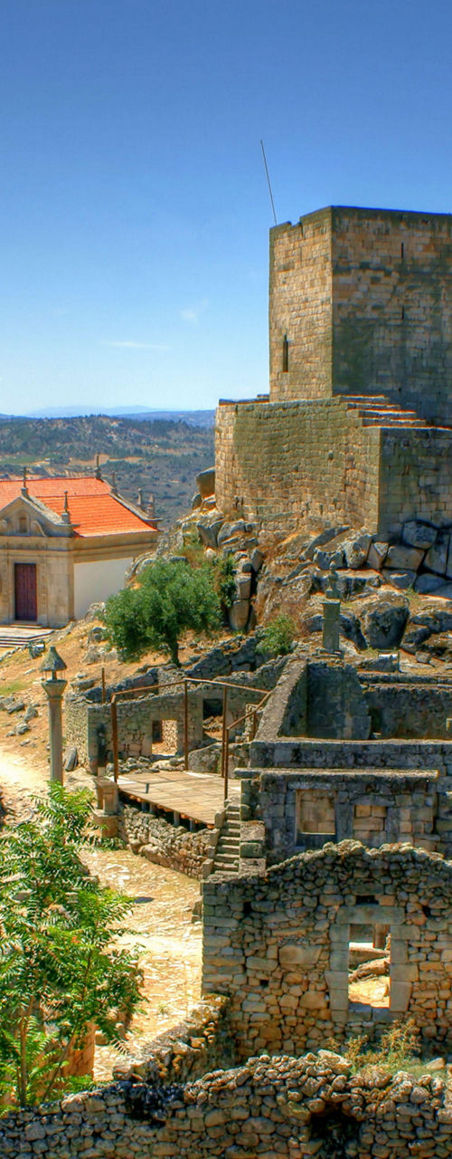 Historic castle ruins in rural landscape