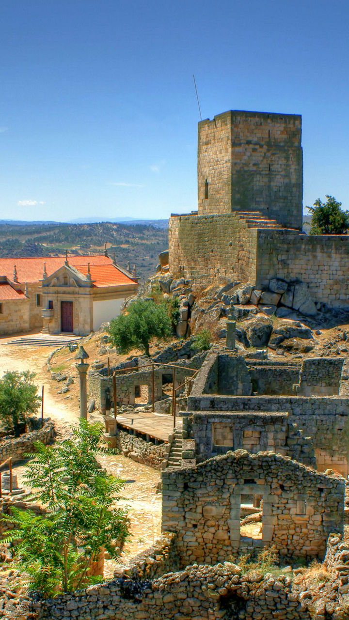 Historic castle ruins in rural landscape