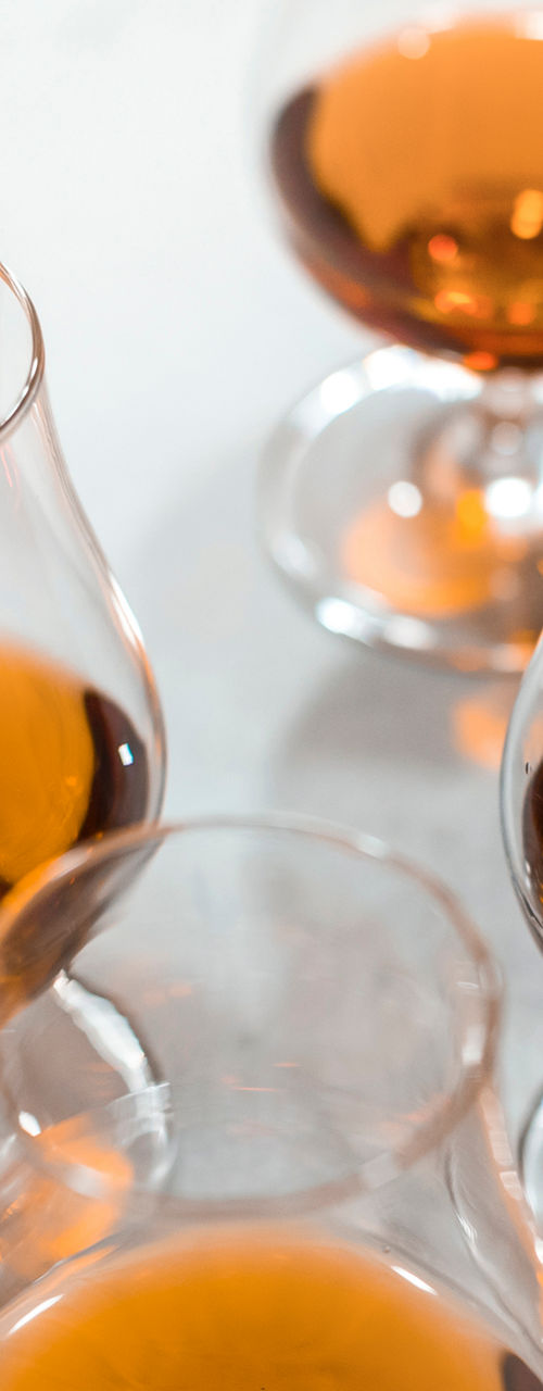 Glasses of amber liquor with chocolate pairing