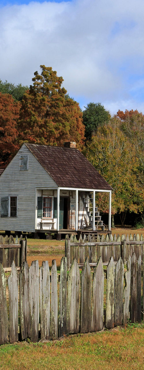 Historic wooden cabins in rural setting