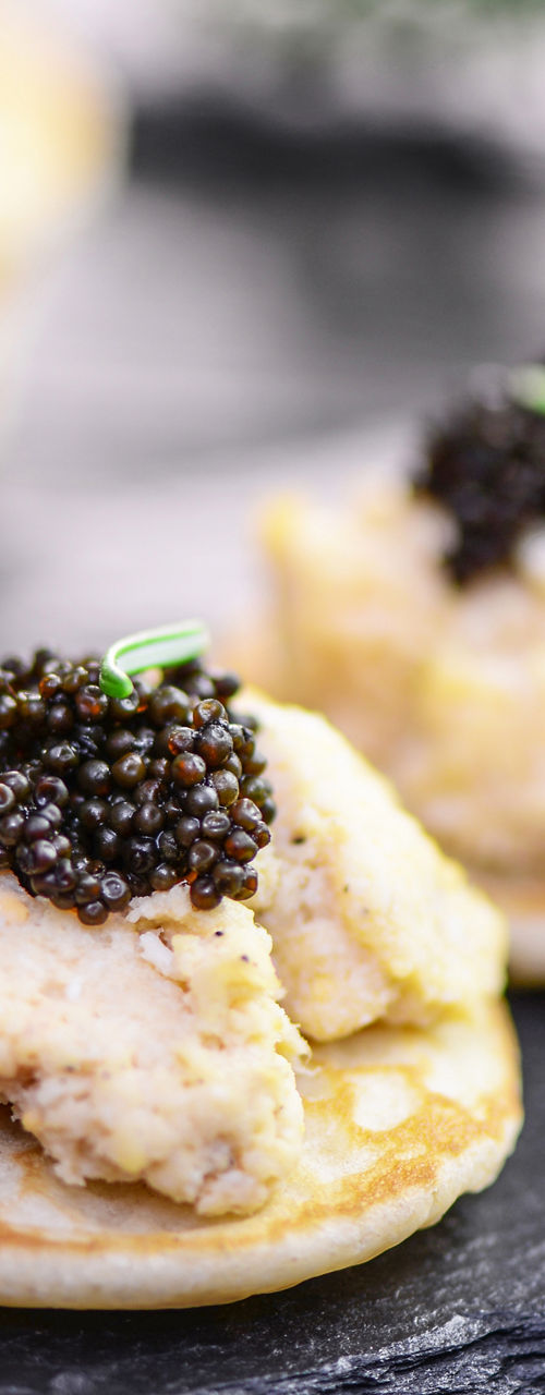 Gourmet canapés with caviar on slate