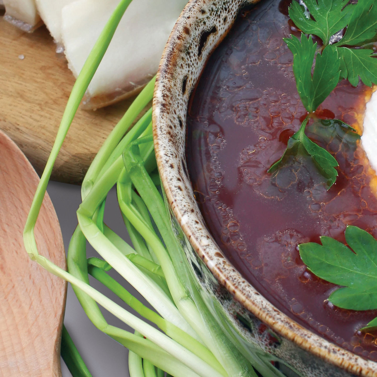 Rustic soup with bread and fresh vegetables
