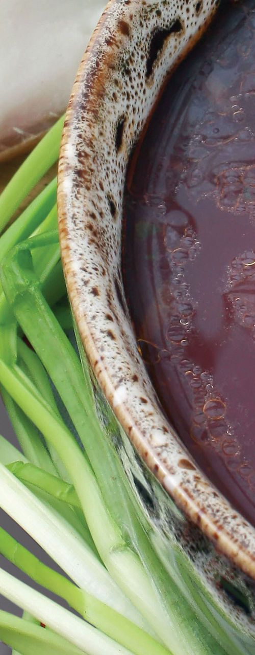 Rustic soup with bread and fresh vegetables