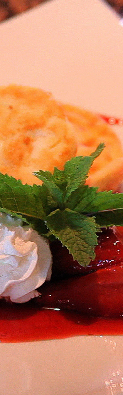 Strawberry dessert with whipped cream garnish