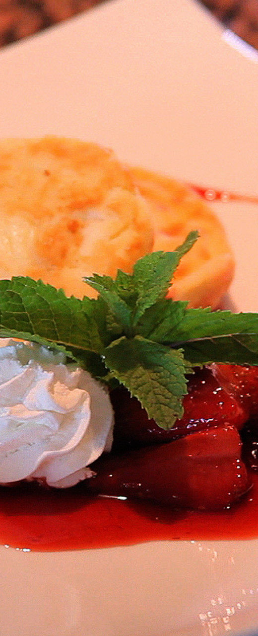 Strawberry dessert with whipped cream garnish
