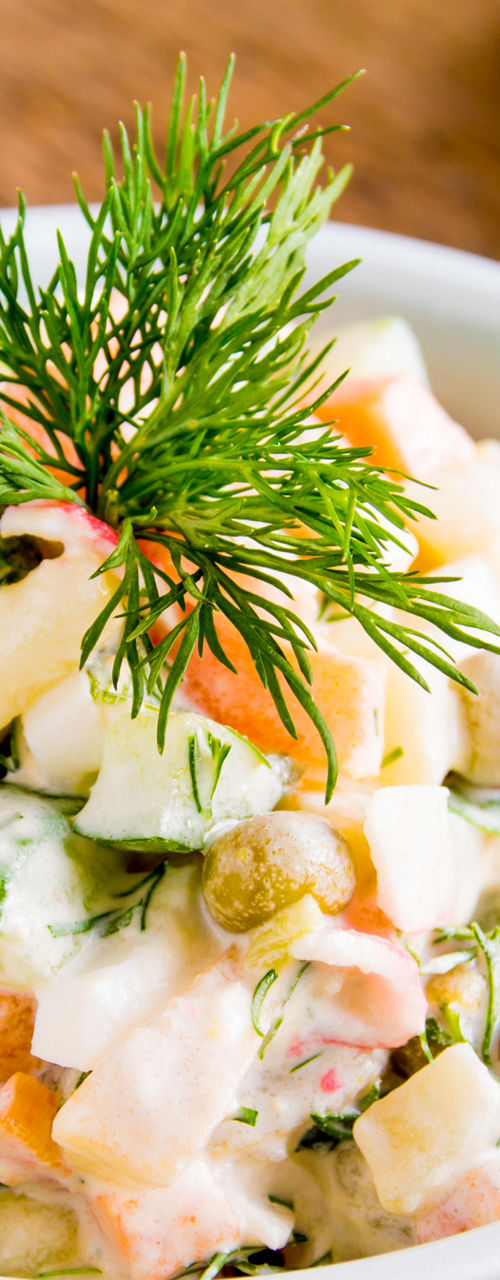 Fresh vegetable salad with dill garnish