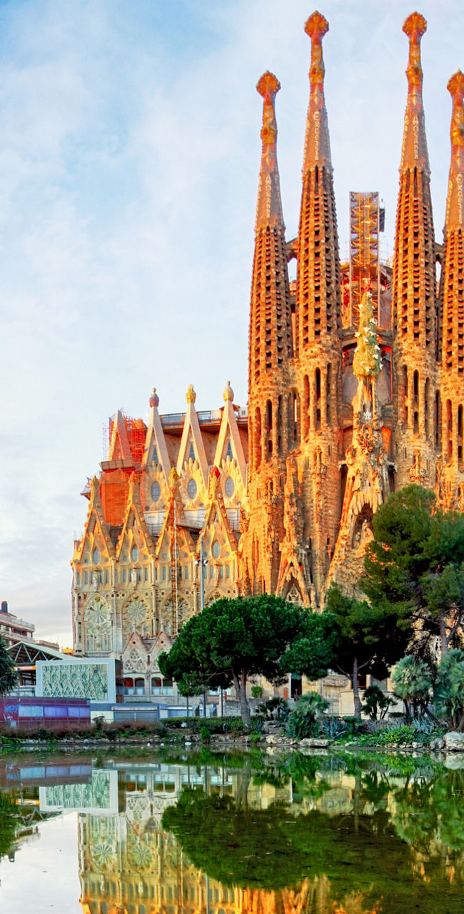 Sagrada Familia reflected in tranquil pond