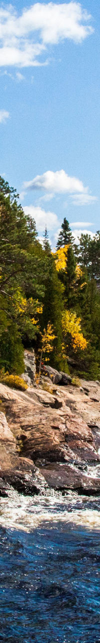 Scenic autumn lake with rocky shoreline