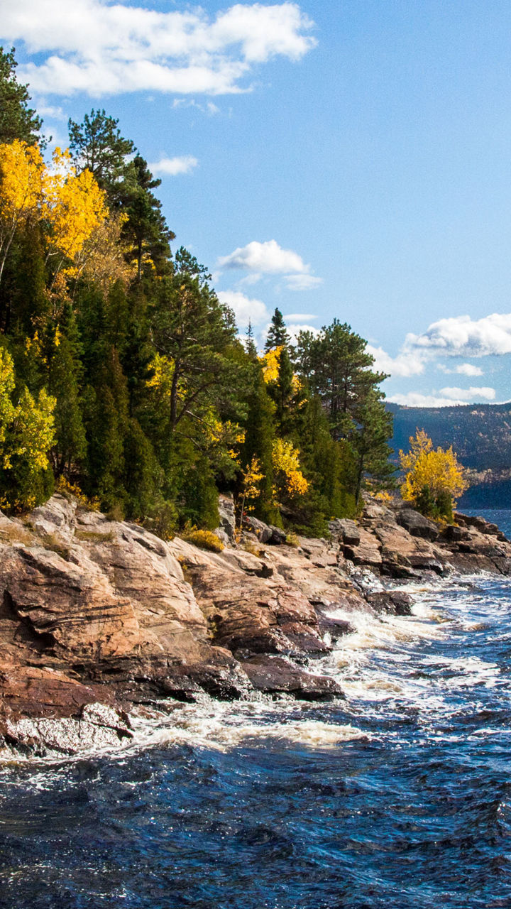 Scenic autumn lake with rocky shoreline