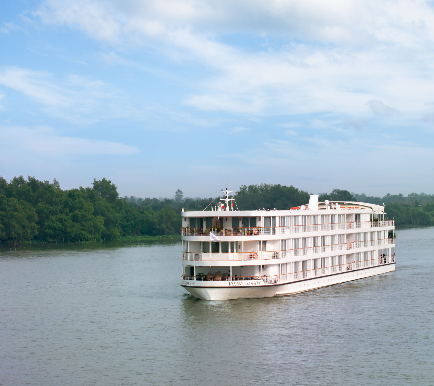 White riverboat cruising on calm waters