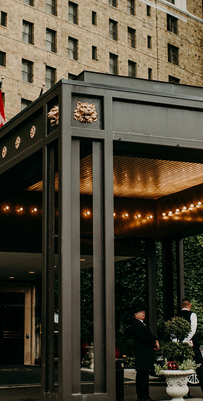Elegant hotel entrance with luxury car