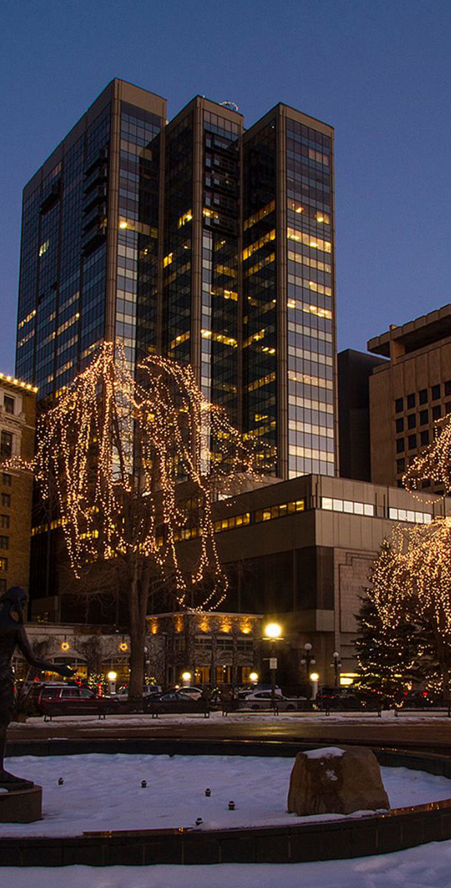 Downtown cityscape with holiday lights at dusk