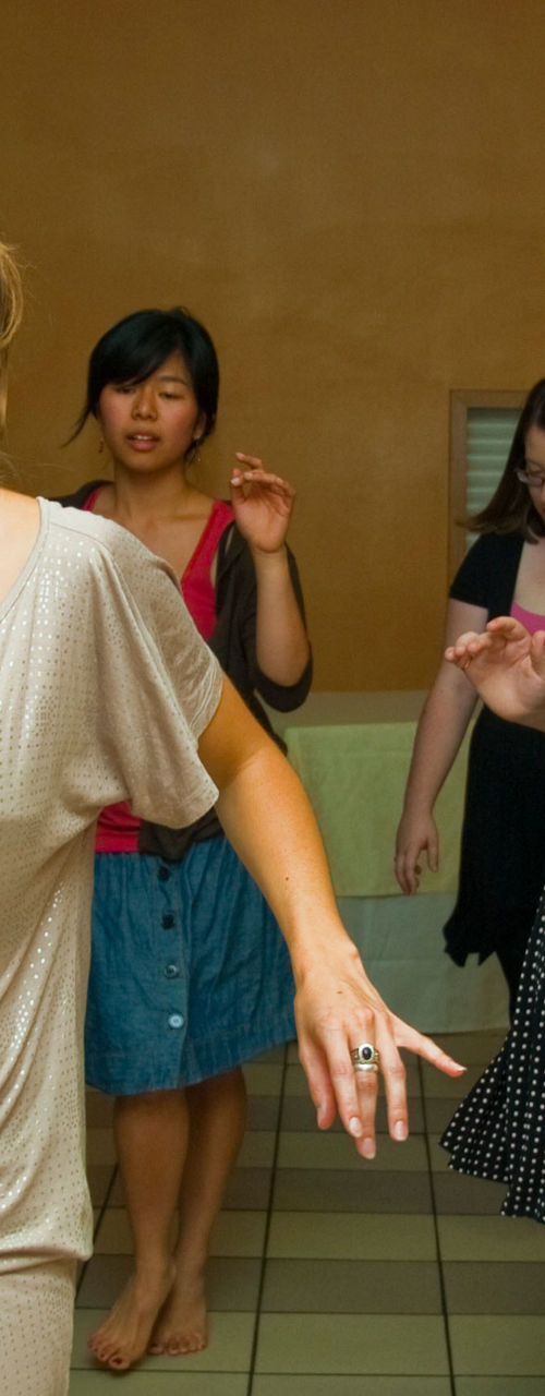 Group of women dancing indoors