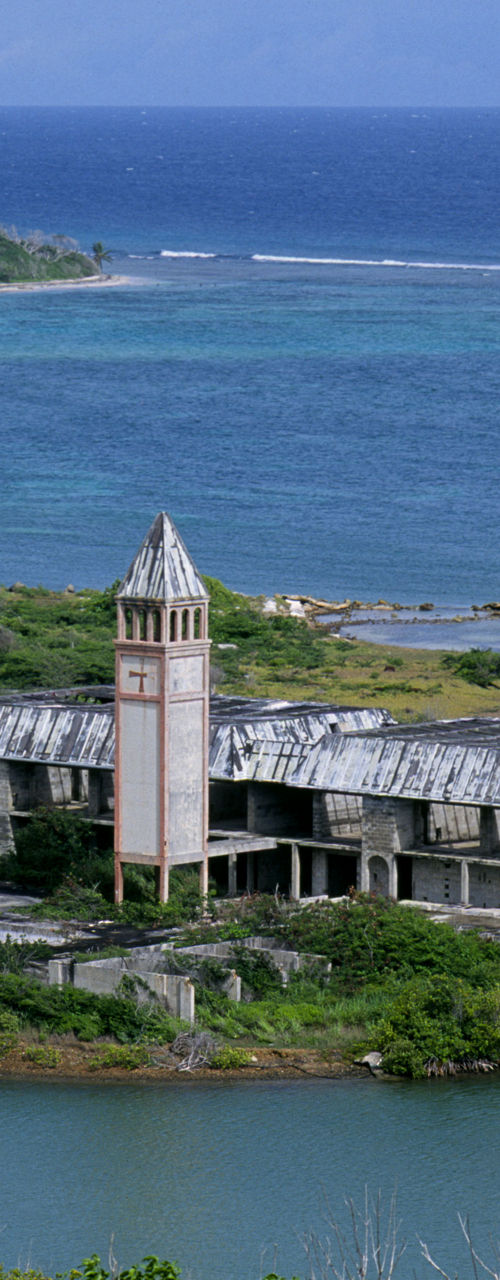 Abandoned coastal building with scenic ocean view