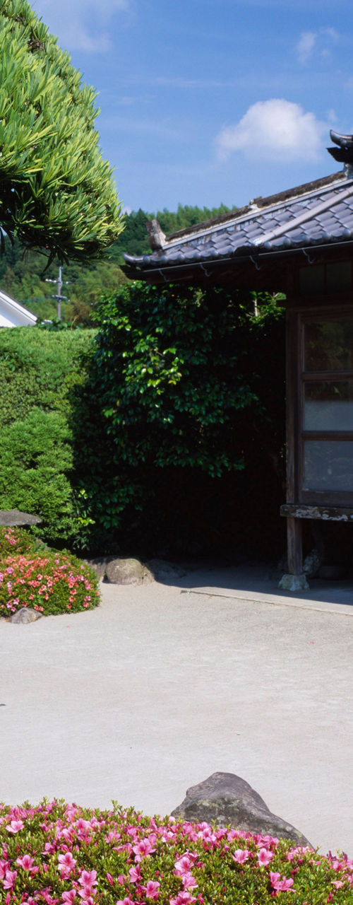 Traditional Japanese garden with wooden house