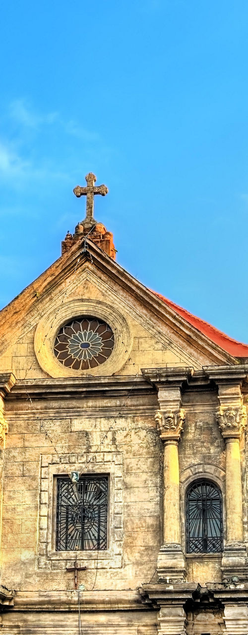 Historic stone church under blue sky