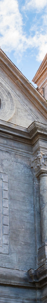 Historic stone church facade under blue sky