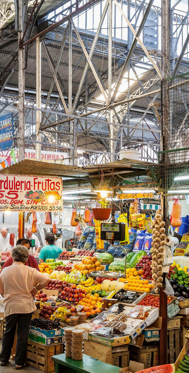 Bustling indoor market with fresh produce