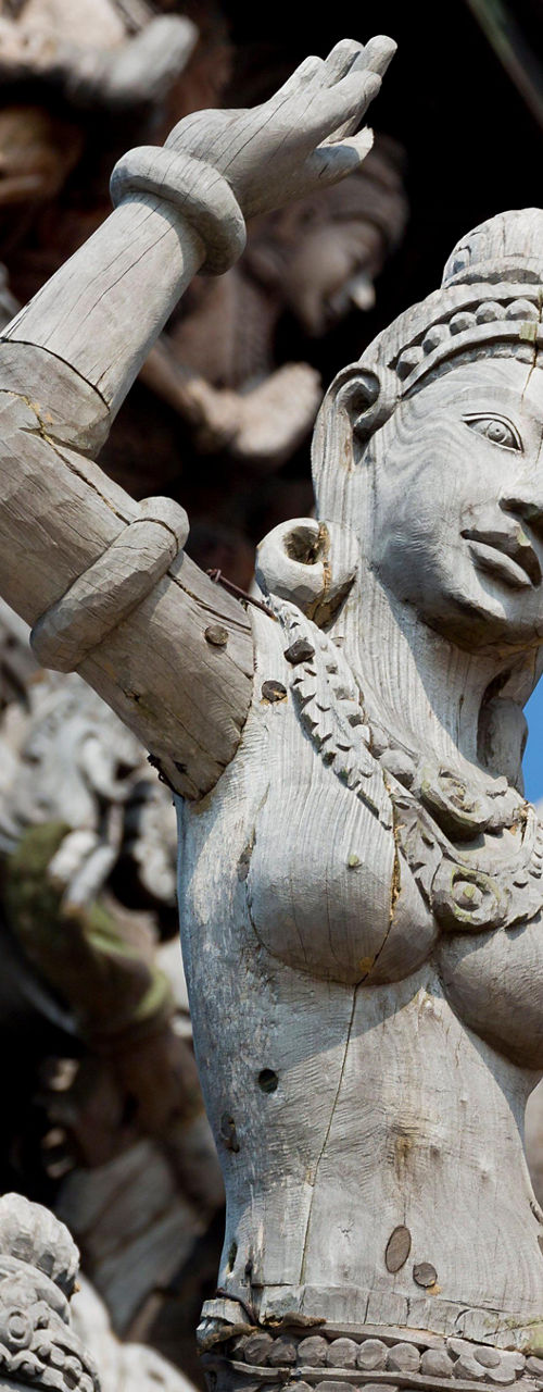 Intricate wooden sculptures in temple setting