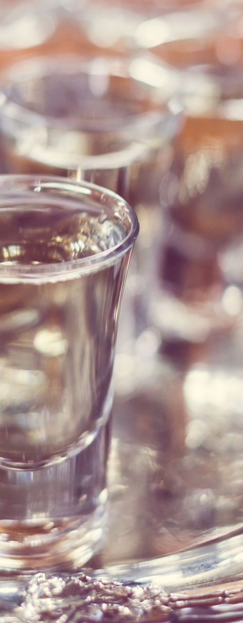 Elegant tray with glasses of clear liquor