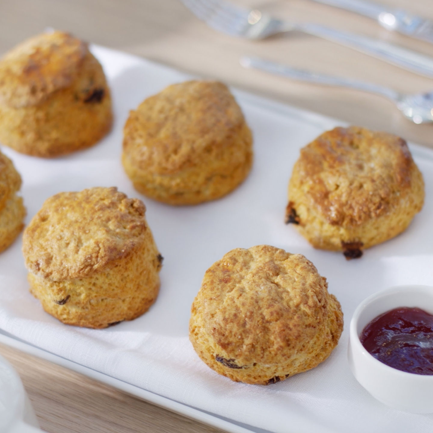 Freshly baked scones with jam and cream