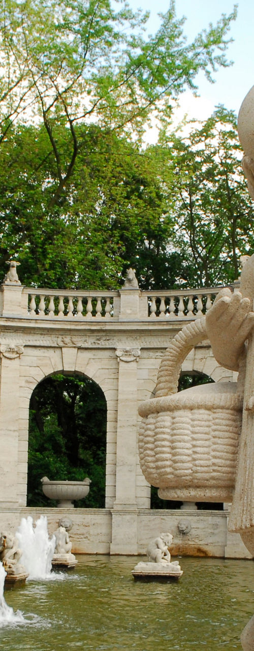 Stone statue in scenic fountain setting