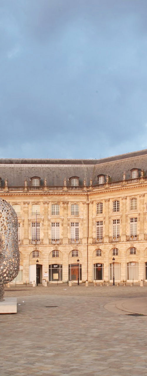 Historic square with sculpture and fountain