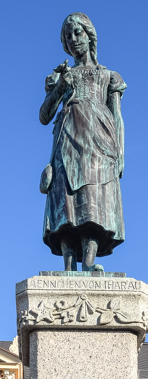 Statue of Simon Dach in urban square