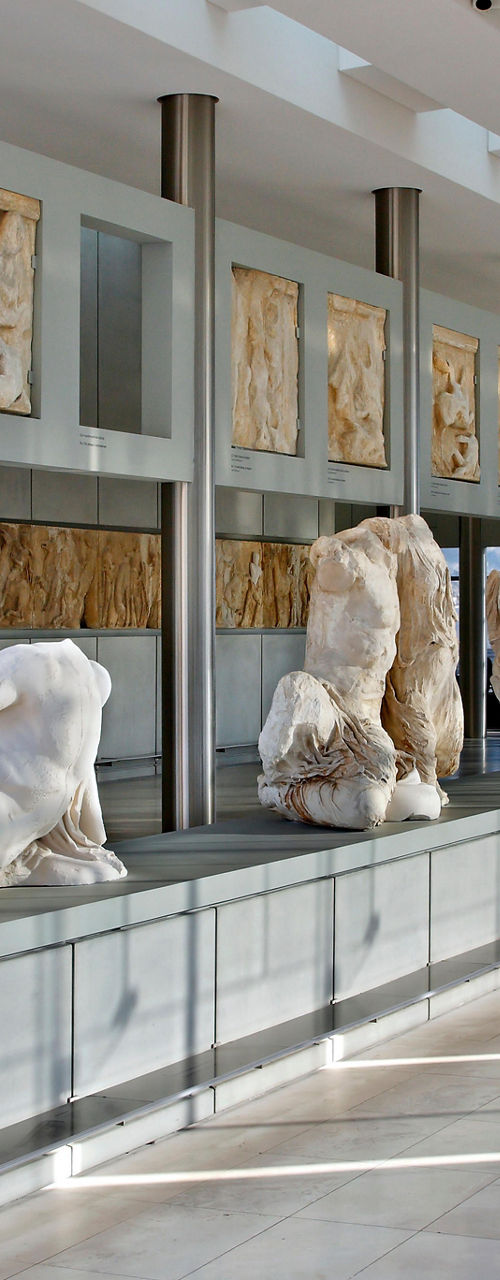 Marble sculptures in modern museum gallery