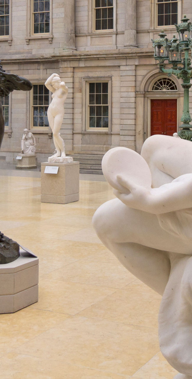 Classical sculptures in grand museum hall